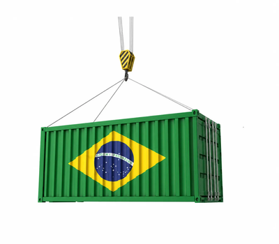 Shipping container with the Brazil flag hanging from a crane hook