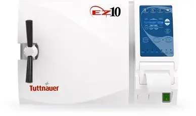 A white machine with a blue screen is sitting on a white surface.