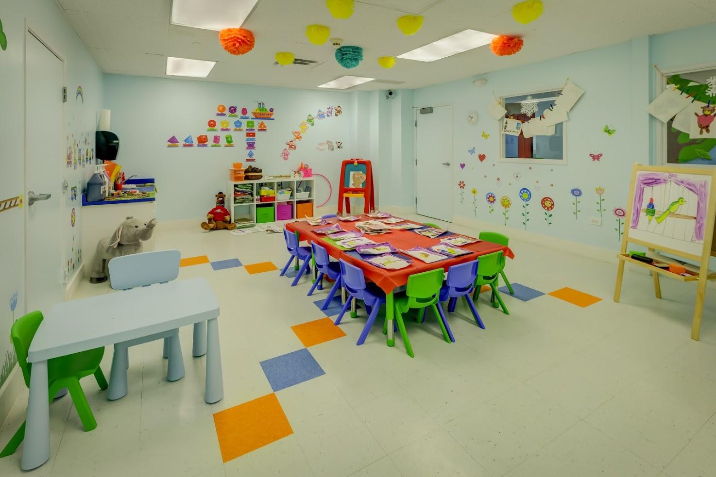 A room with a table and chairs in it