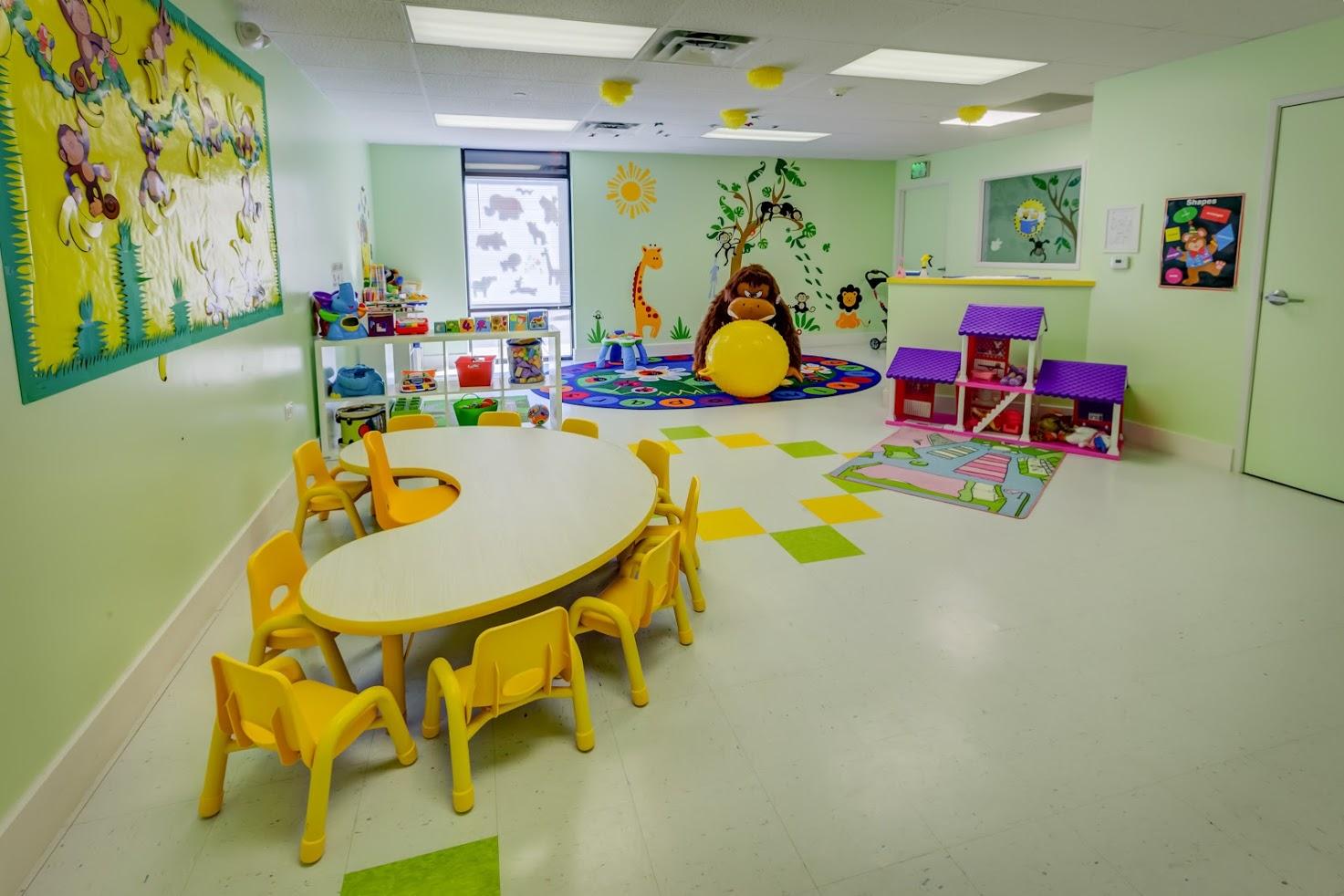 A room with a table and chairs in it
