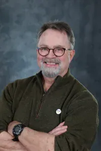 Silhouette of a person, head and shoulders, on a neutral background.