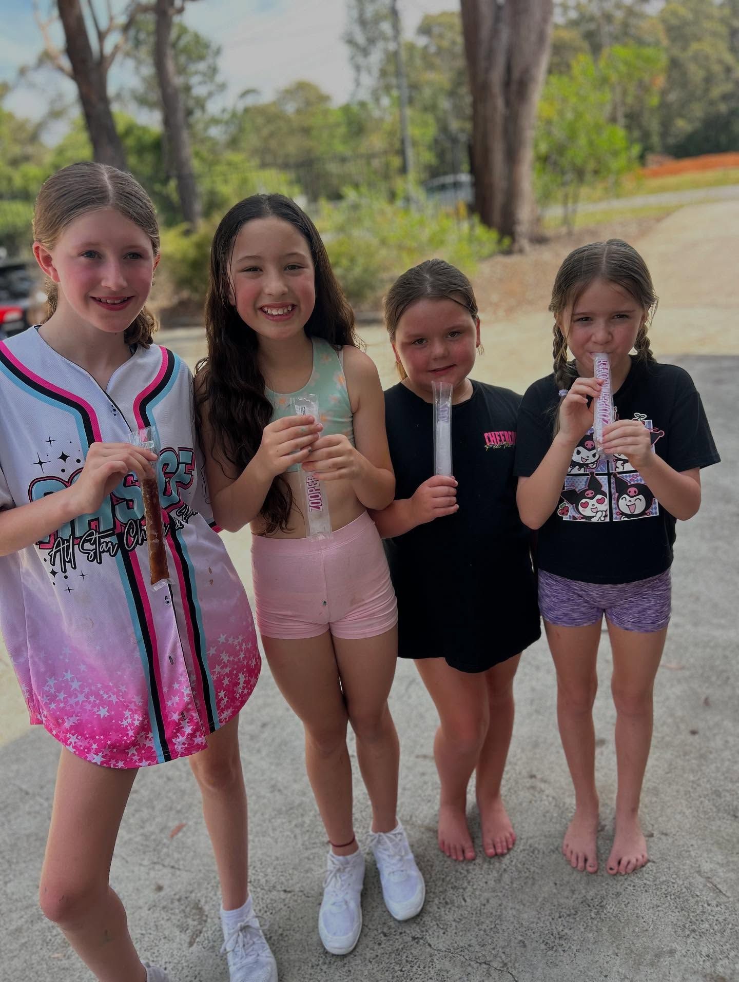 Four Girls Holding Popsicles, Smiling Outside — iDance Performance Co In Medowie, NSW