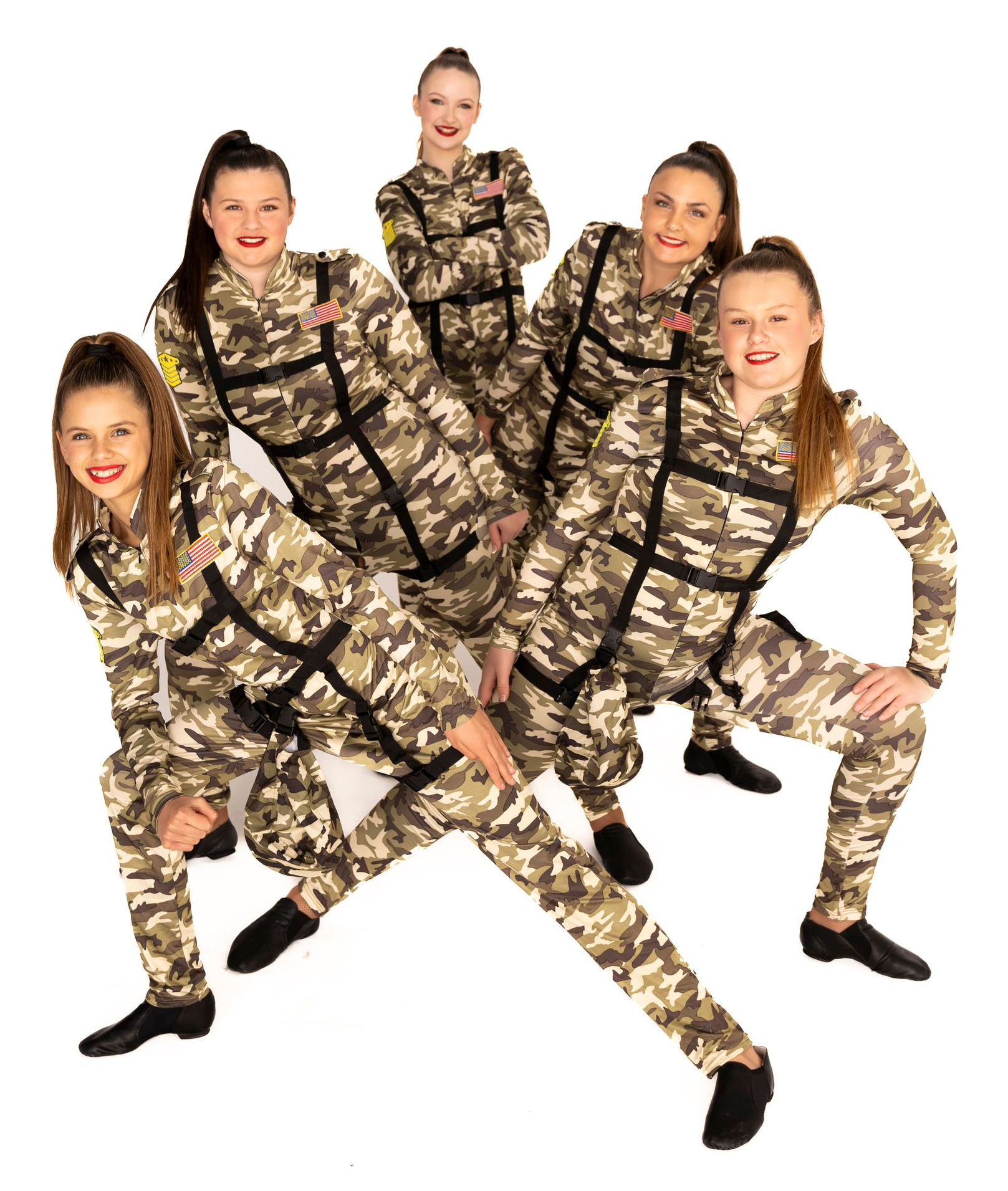Six Dancers in Camo Jumpsuits Pose on a White Background — iDance Performance Co In Medowie, NSW