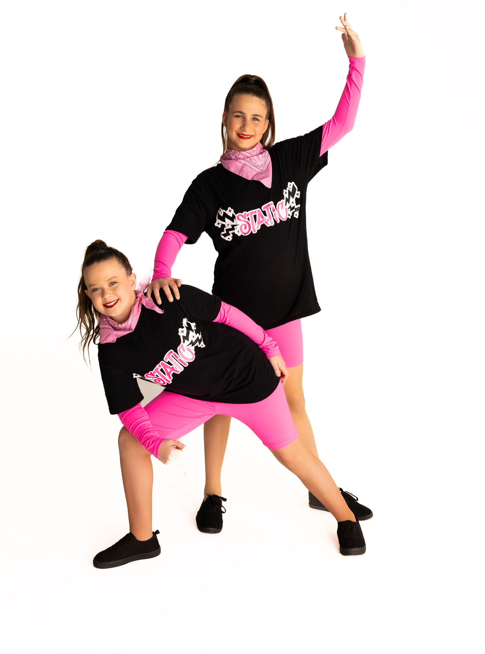 Two Dancers in Black Tees, Pink Arm Sleeves, and Shorts — iDance Performance Co In Medowie, NSW