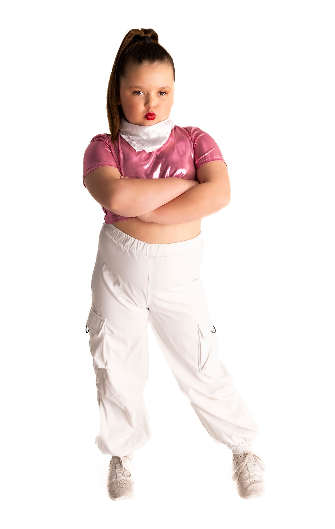 Girl in pink top and white pants with arms crossed — iDance Performance Co In Medowie, NSW