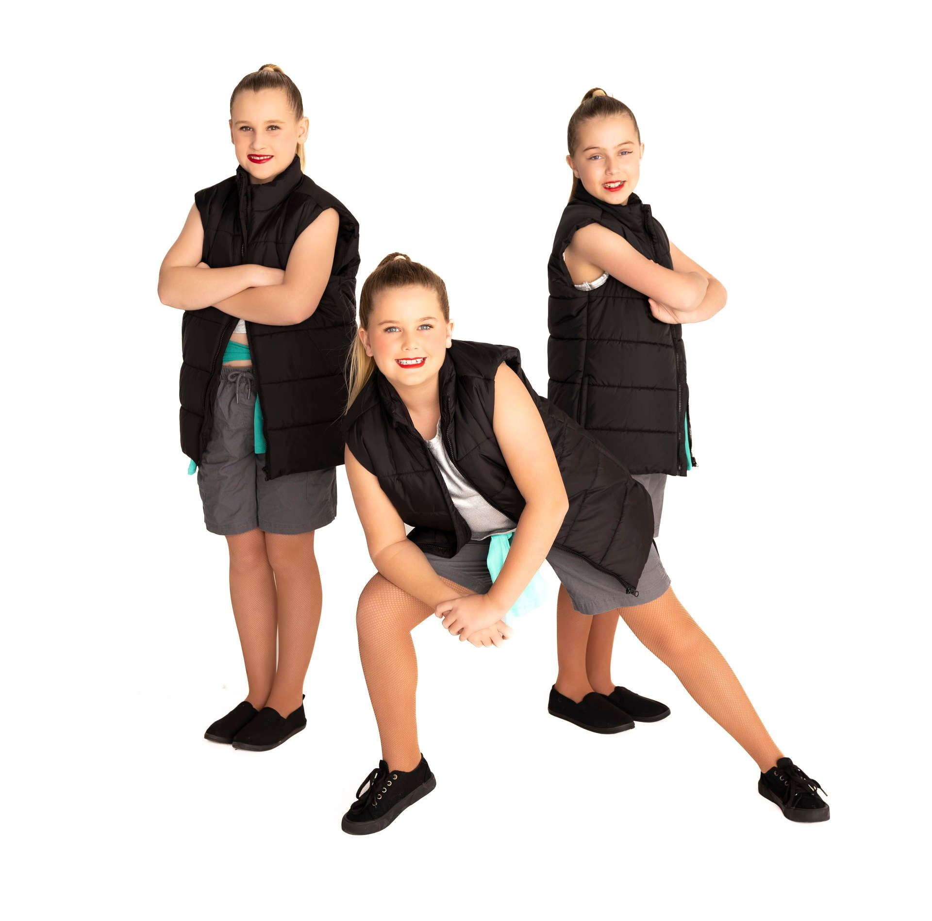 Three people in black vests and shorts posing for a photo — iDance Performance Co In Medowie, NSW