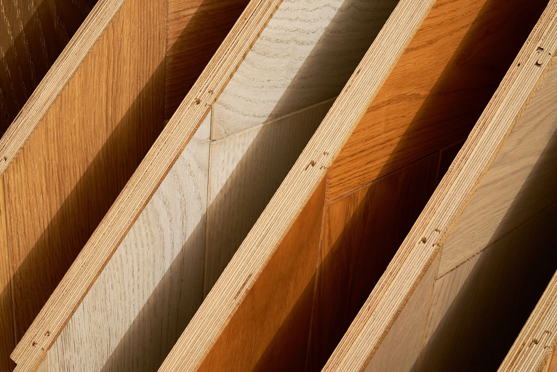 Stacked engineered wood planks. Stacked engineered wood planks.