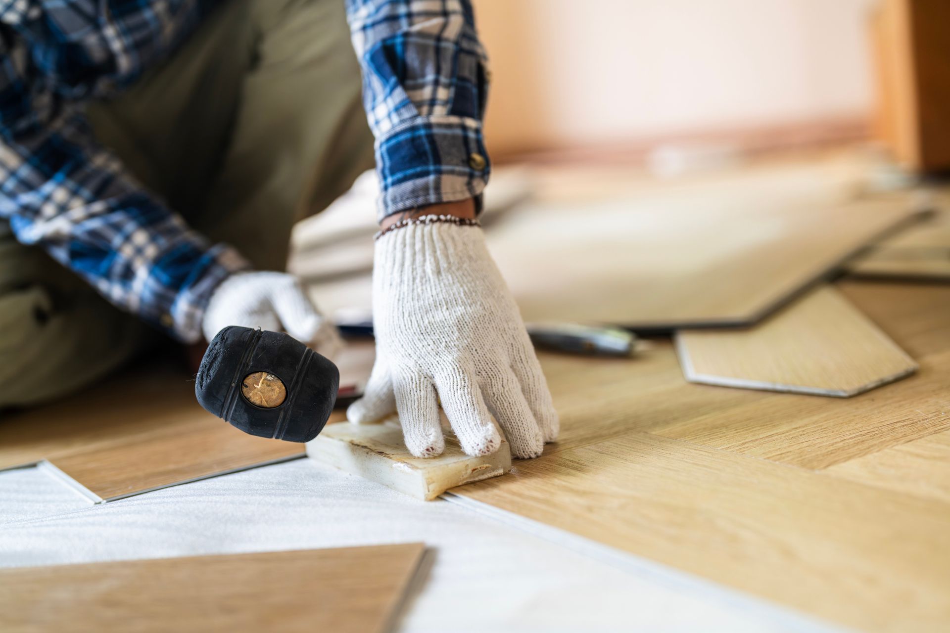 Installing wood flooring.