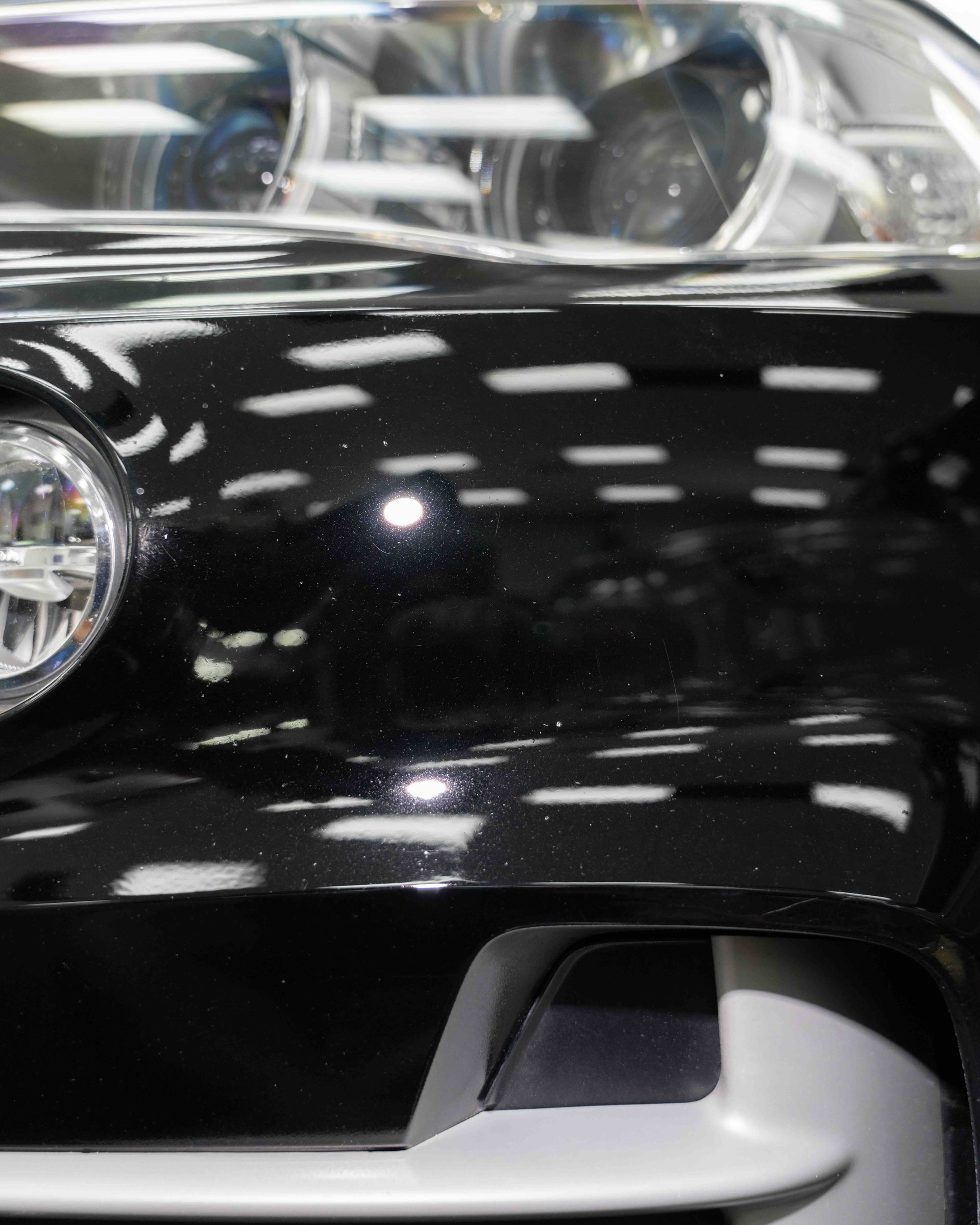 A close up of the front of a black car