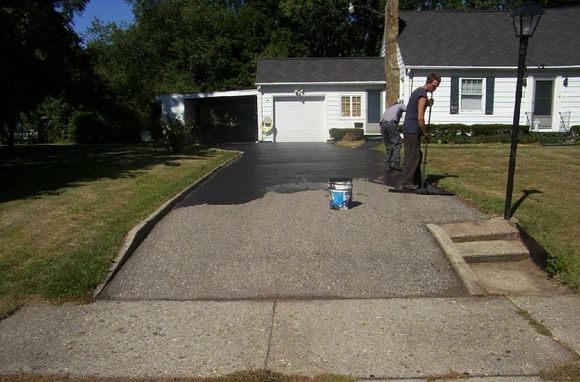 Workers Repairing Asphalt Driveway — Battle Creek, MI — Damron Brother’s Asphalt