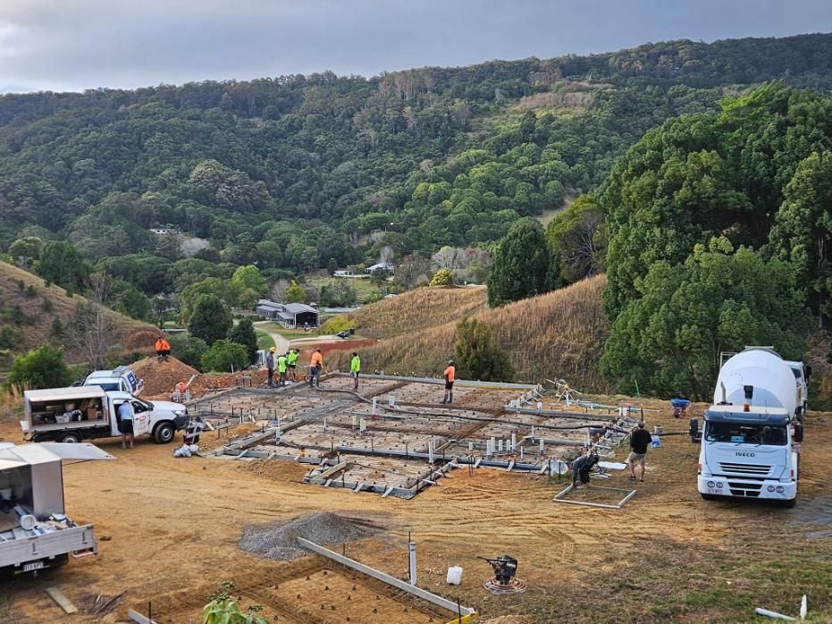 A Construction Site with A Lot of Trucks and Workers — Kontek Constructions in Jimboomba, QLD