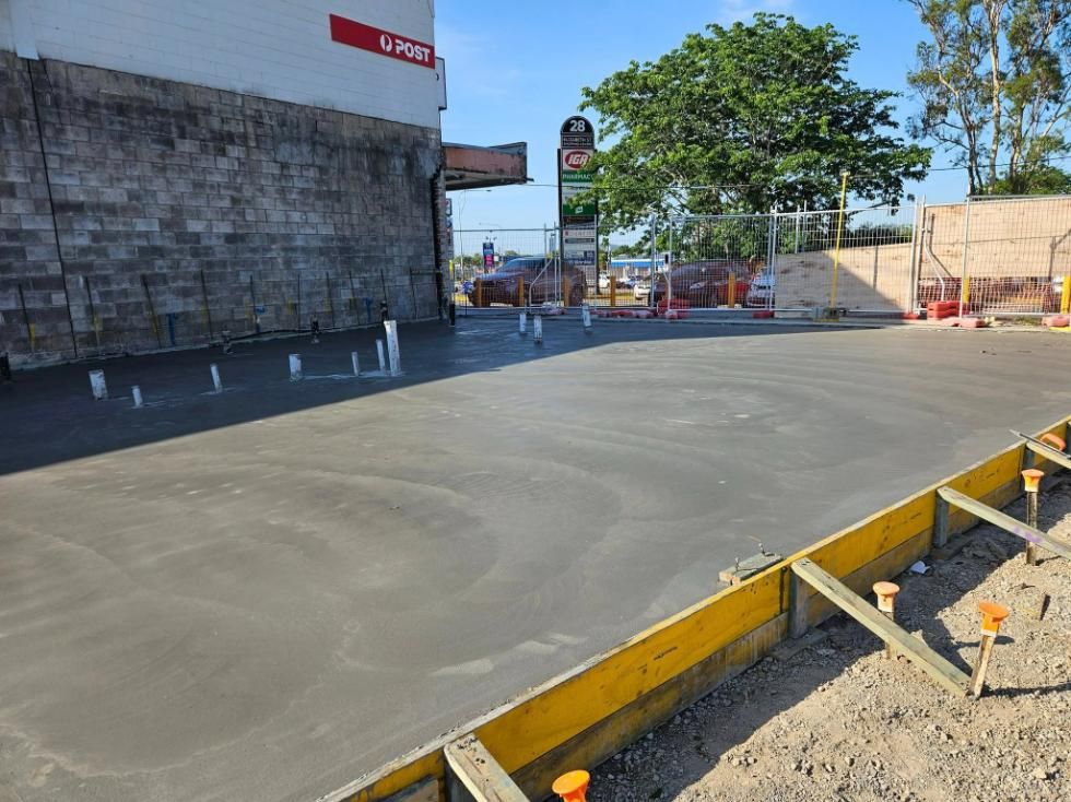A Concrete Driveway Is Being Built — Kontek Constructions in Brisbane, QLD
