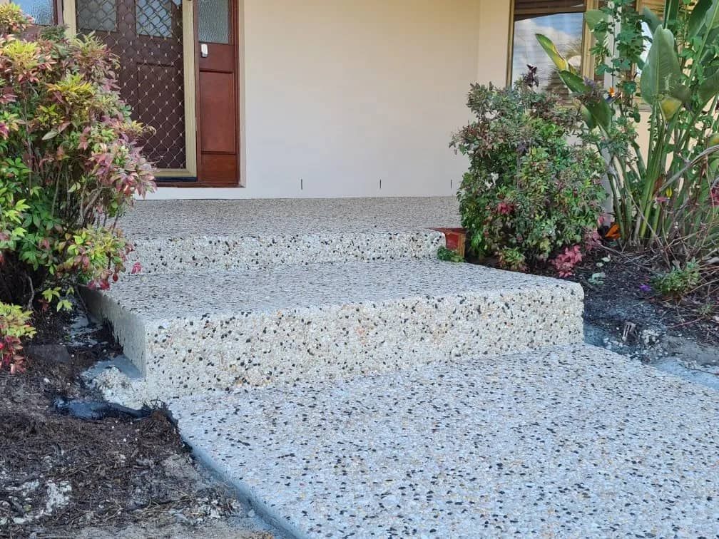 A Concrete Walkway Leading to the Front Door of a House — Kontek Constructions in Beaudesert, QLD