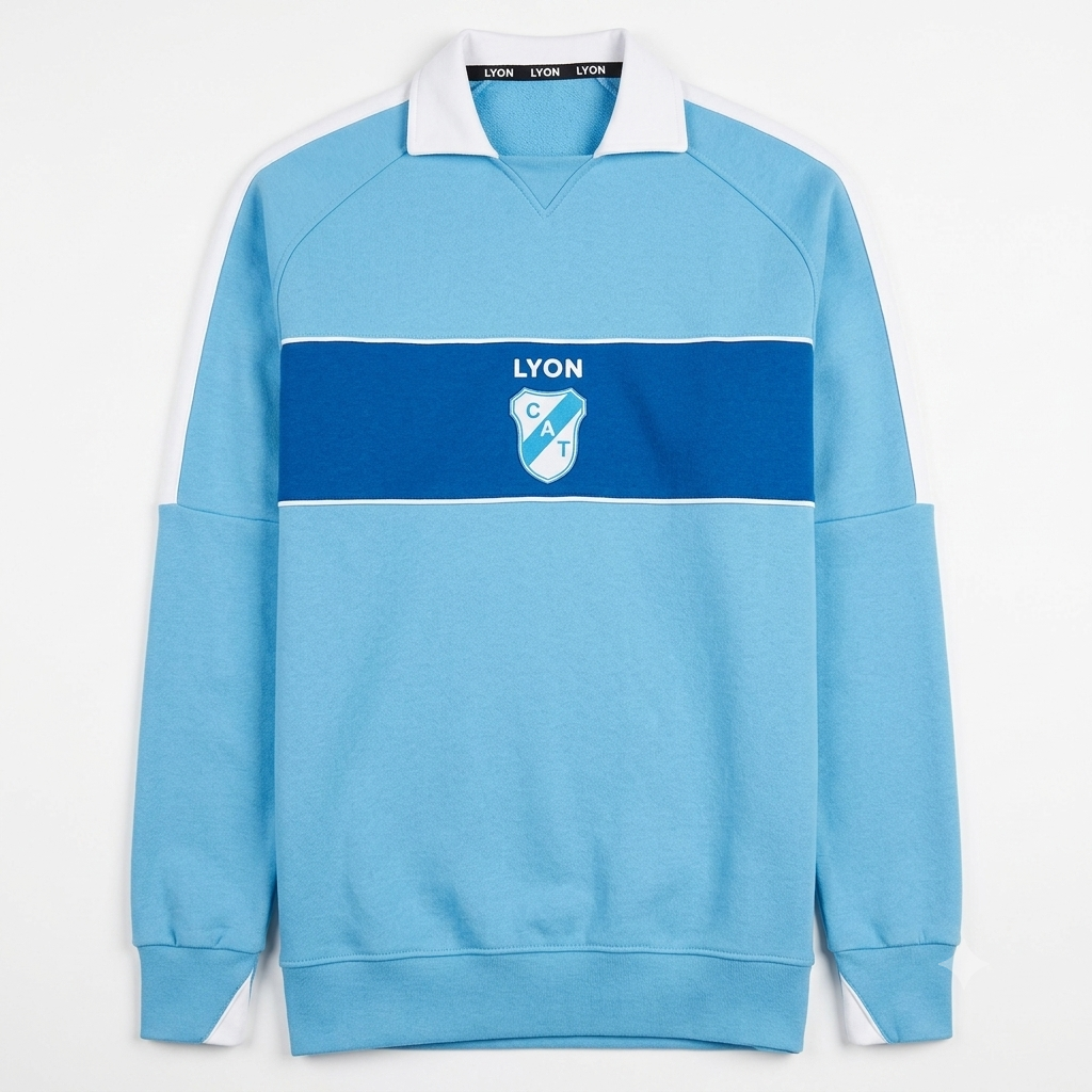 Camiseta de rugby azul claro de manga larga con cuello blanco y escudo del Lyon en el pecho.