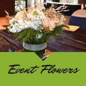 Floral centerpiece with white and pink flowers on a table, labeled “Event Flowers”