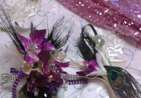Purple and silver decorative butterfly hair clips on a pink glittery background