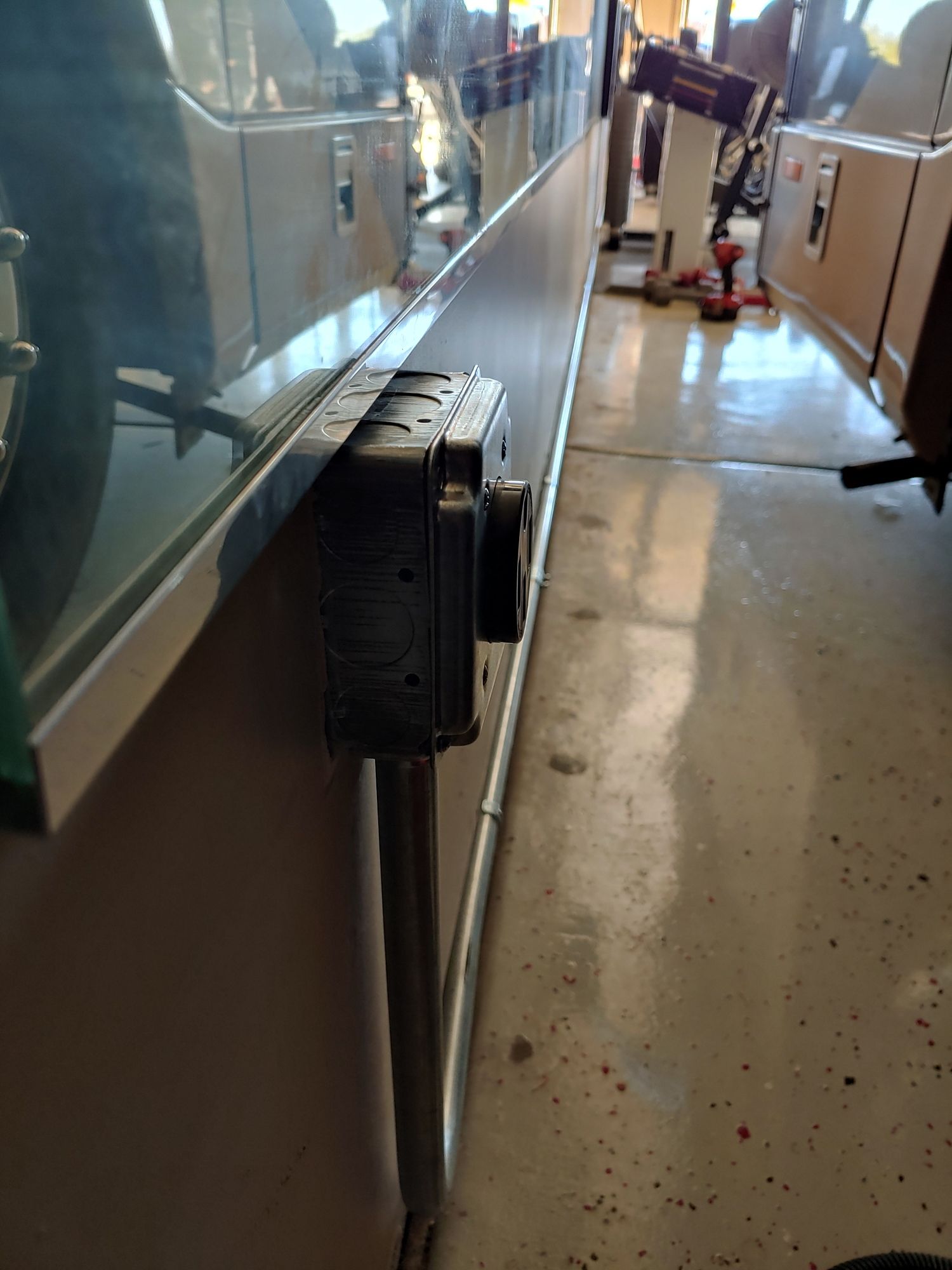 A row of electrical outlets on a wall in a room