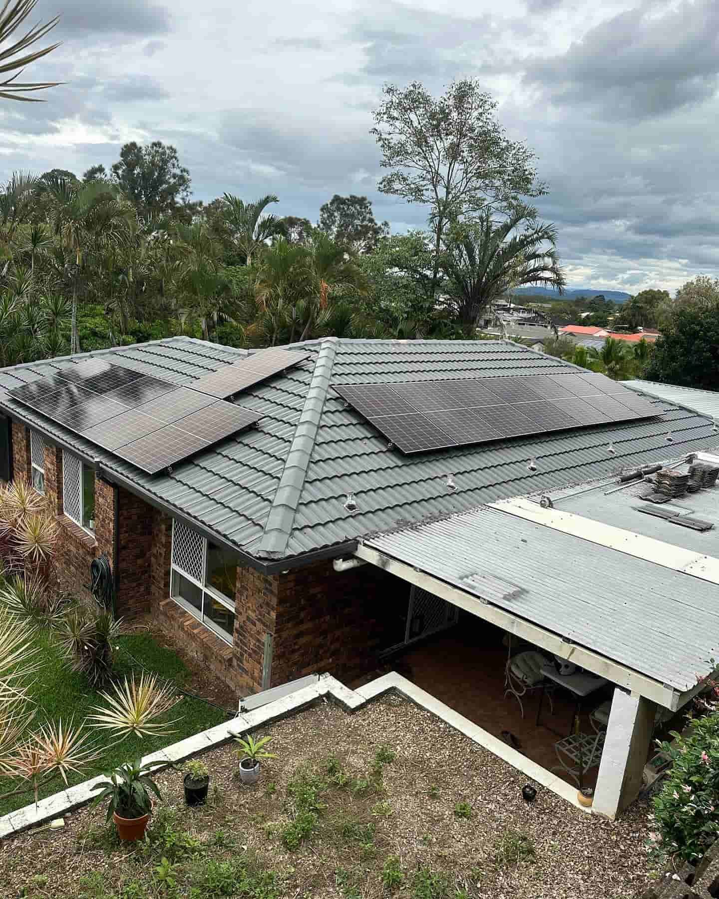 A Brick House With Solar Panels On The Roof — Grand Casa Electrical Solar & Batteries In Ocean Shores, NSW