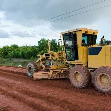 Yellow motor grader road working on road construction site of new road