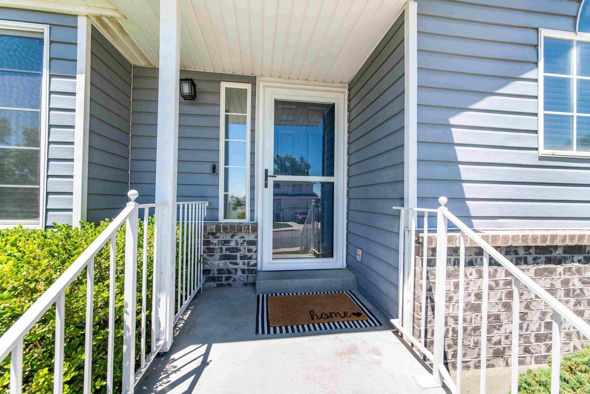 a door with a welcome mat that says home on it