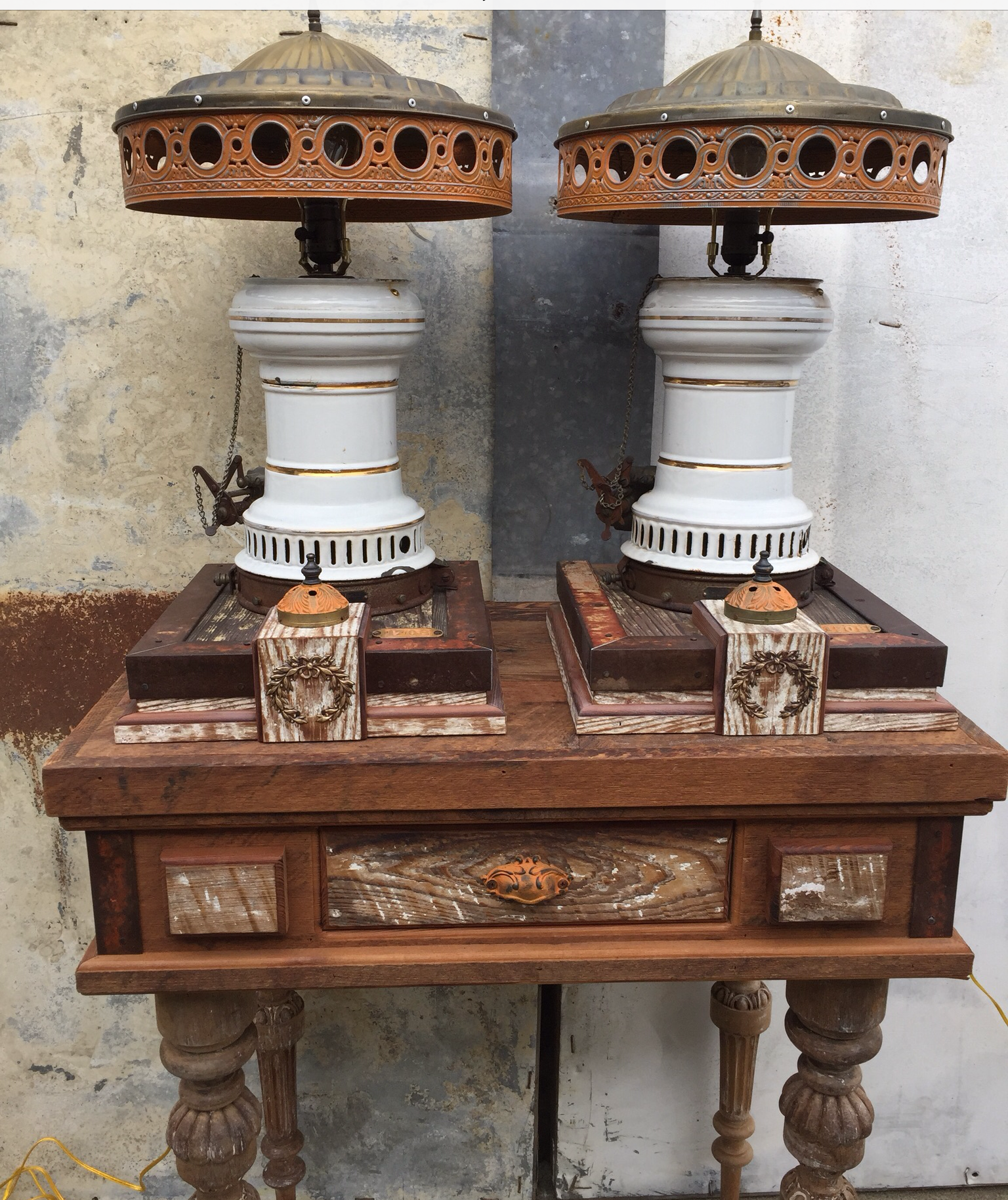 A pair of lamps sitting on top of a wooden table.