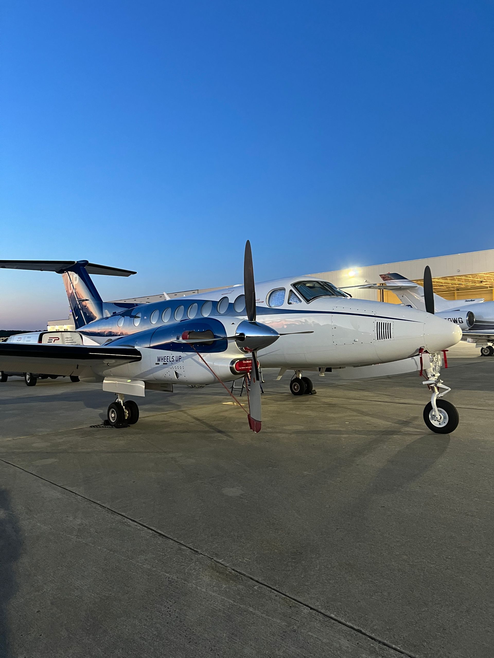 Image of small aircraft lined up at an airfield, emphasizing aviation detailing services.
