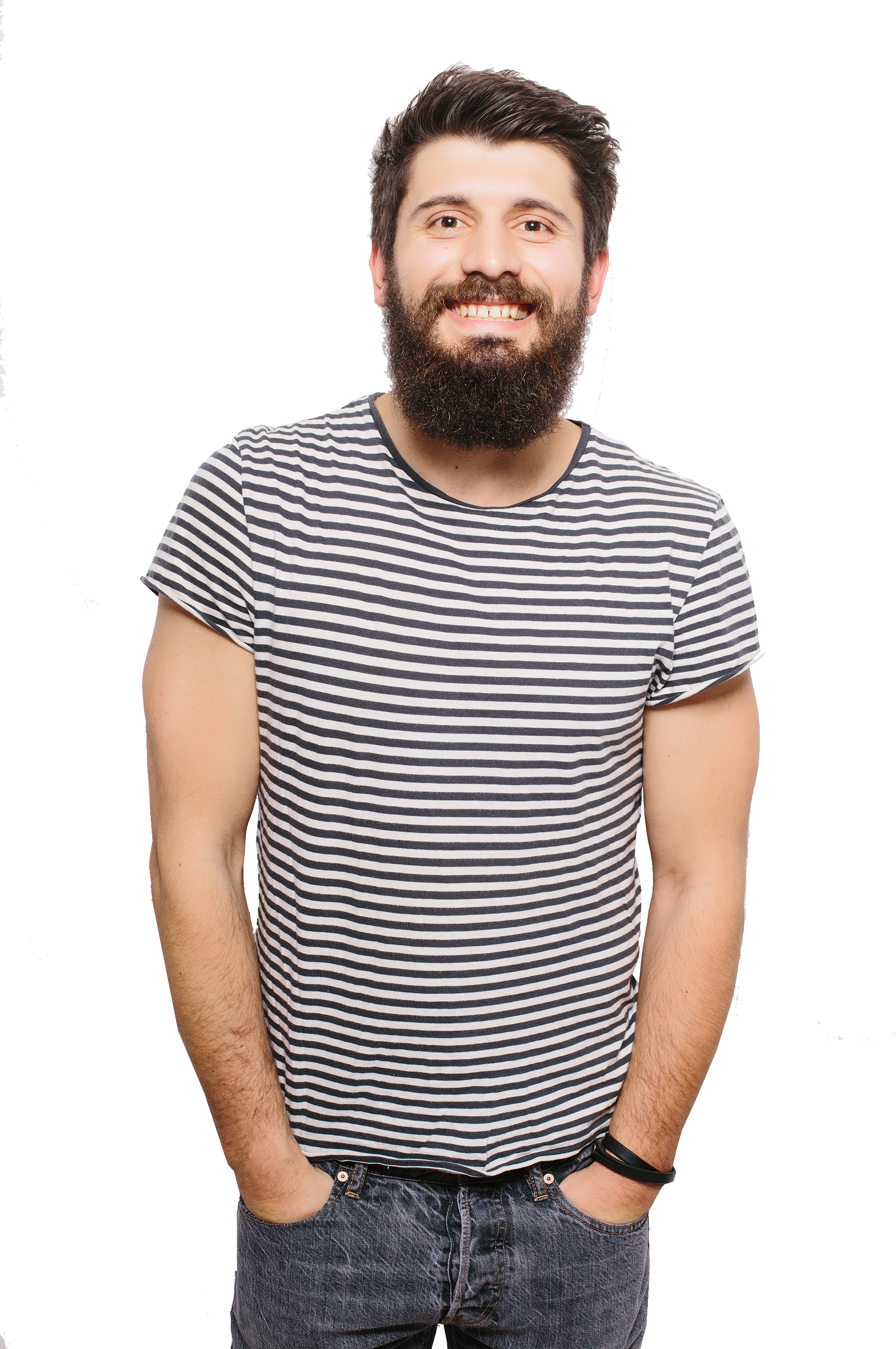 A man with a beard is wearing a striped shirt and jeans.