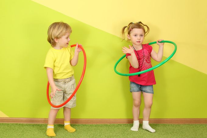 Lala's Lullaby's group Family Day Care - two children playing with hula hoops