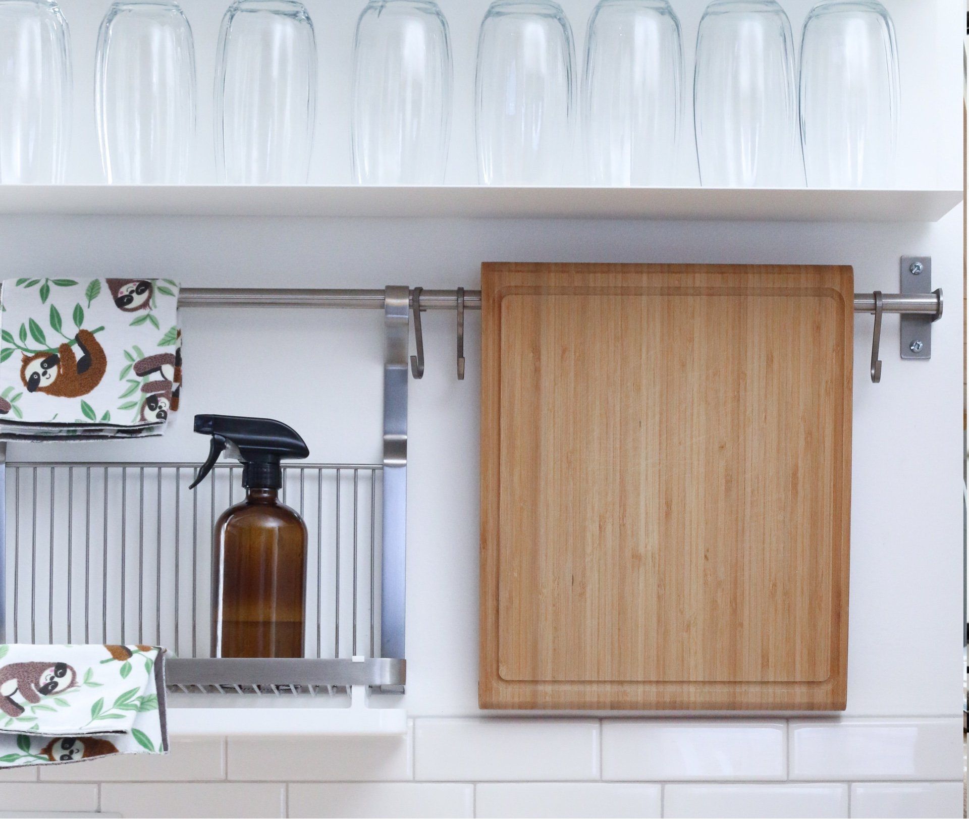 A kitchen with a cutting board and a spray bottle