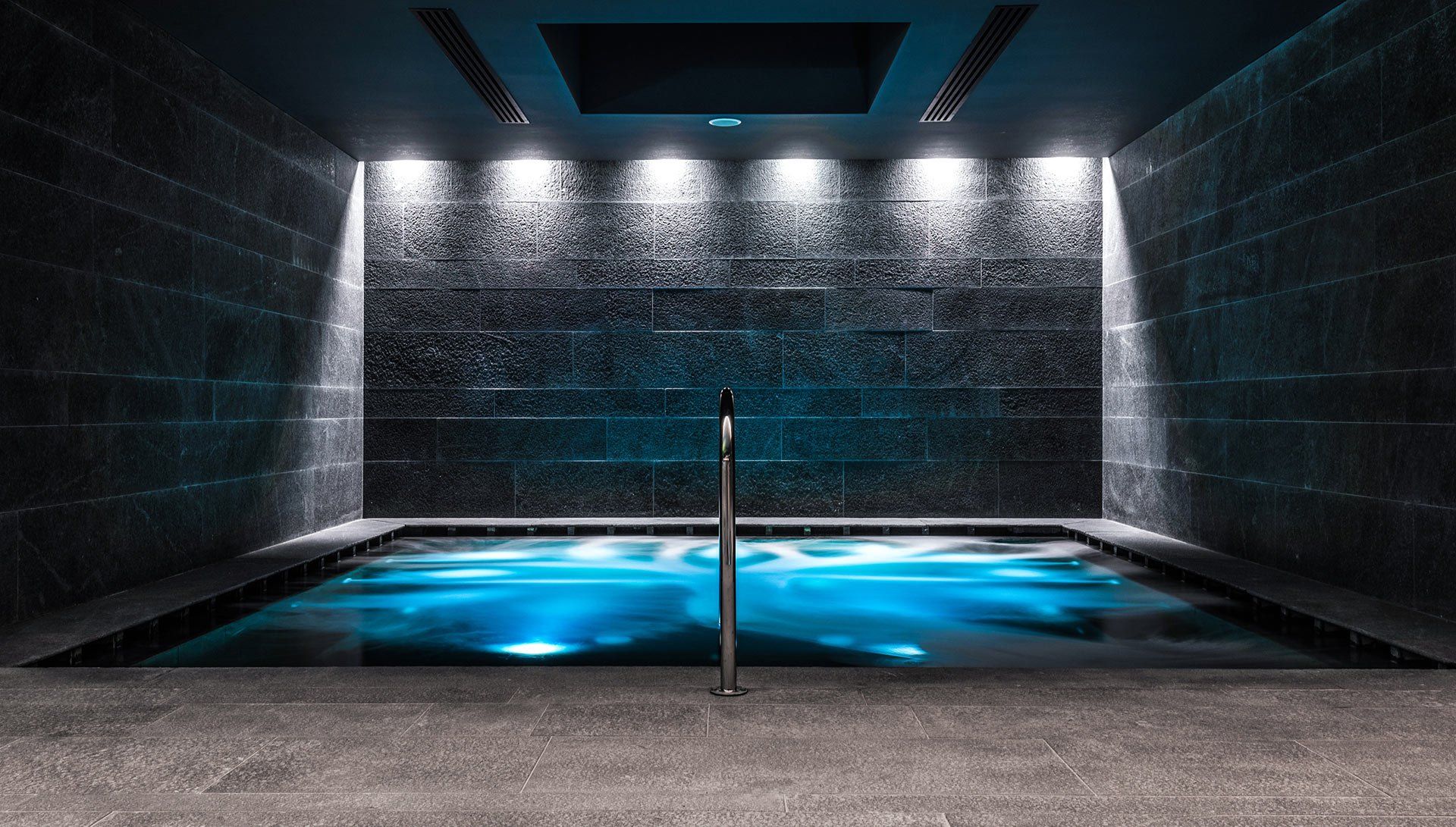 There is a large swimming pool in the middle of the room.
