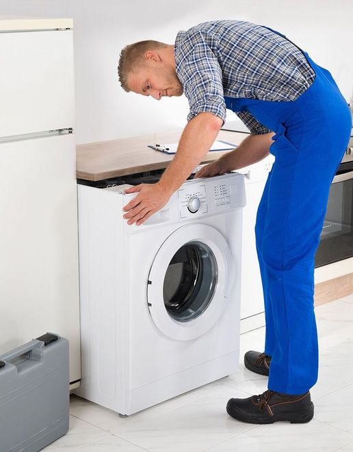 Electrician installing a domestic appliance