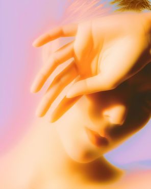 Soft hands resting gently in warm light, symbolizing calm doula support for Filipino mamas