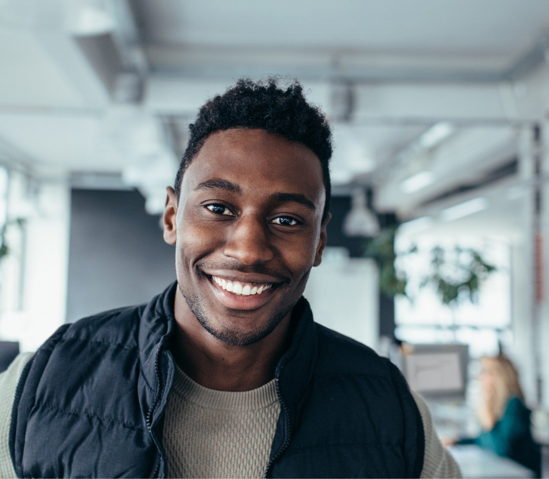 An image of a young black man smiling.