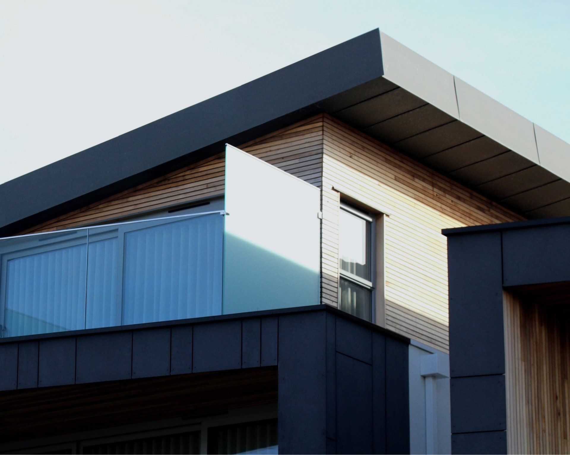 A house with a balcony on the side of it