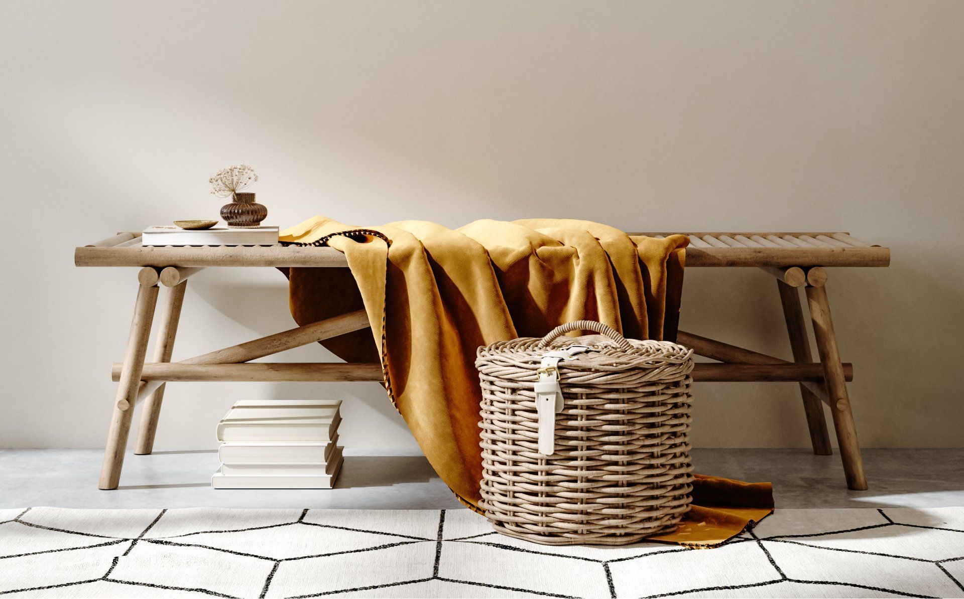 Wooden bench with yellow blanket, wicker basket, and books on geometric rug.