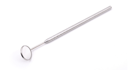 A close up of a dental mirror on a white background.