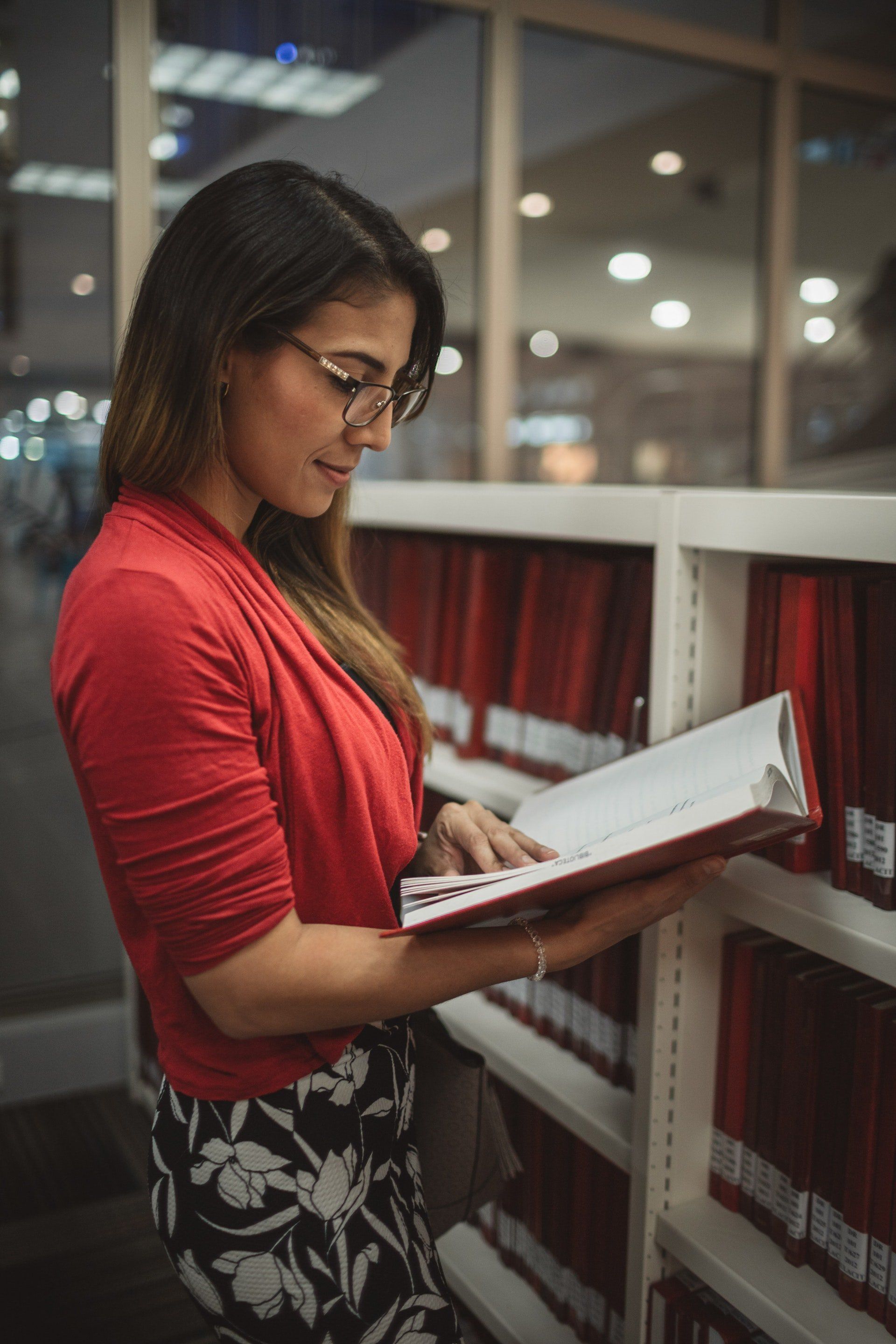 student reading red book