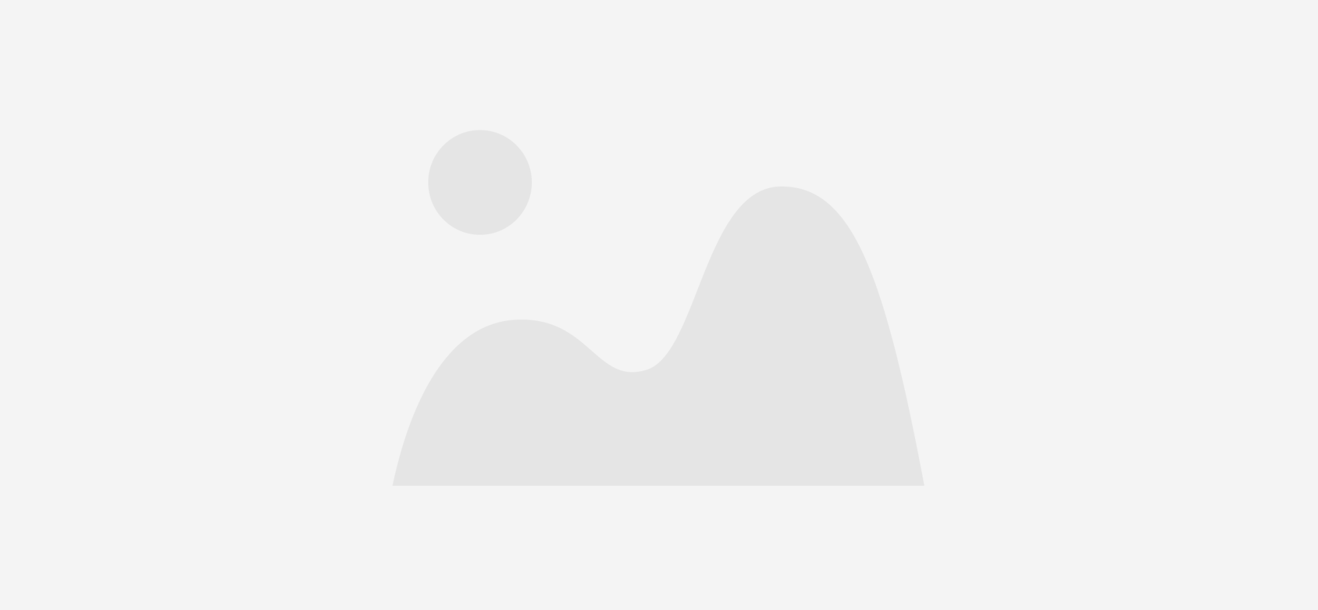A gray icon of a mountain on a white background.