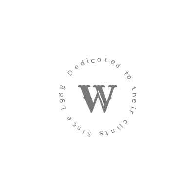 A black and white logo with the letter w in a circle.
