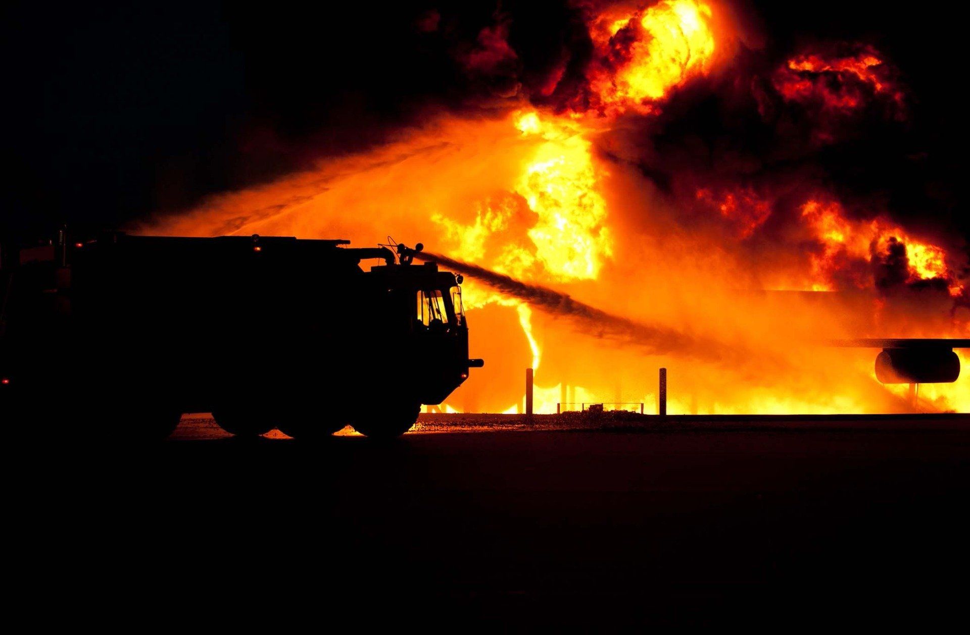 firefighters combating blazing fire