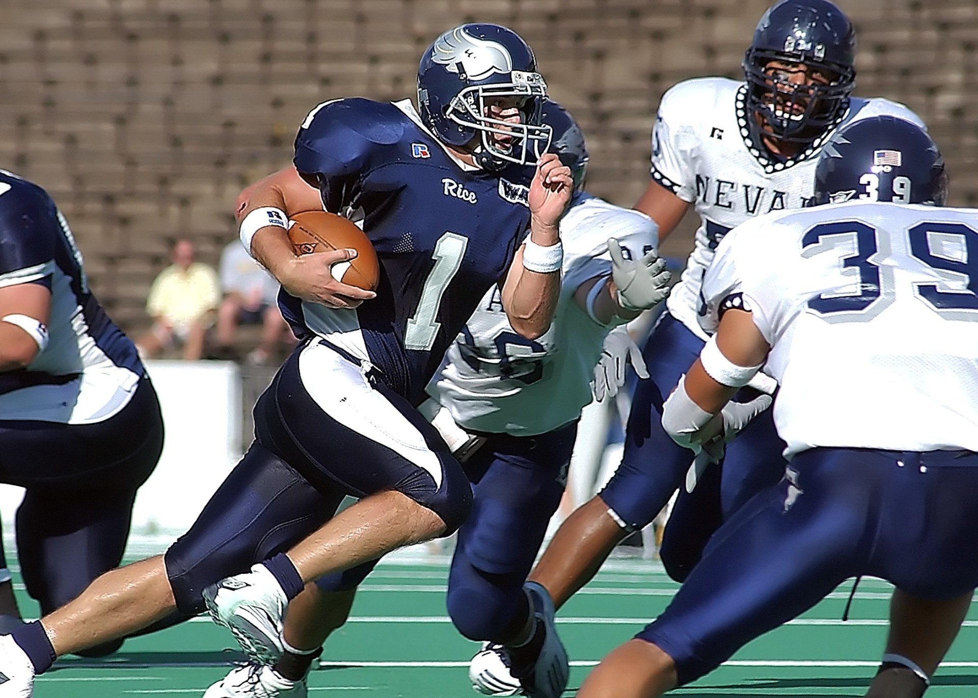A football player running with the ball.