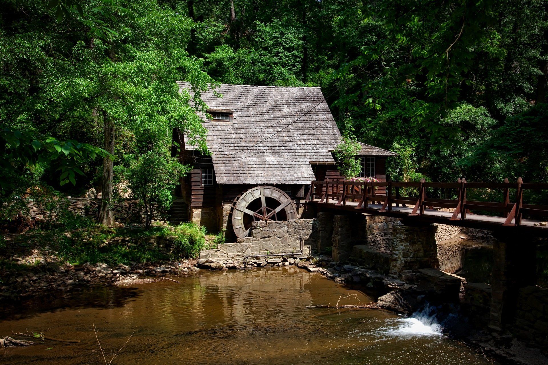 Lumber mill powered by a water wheel