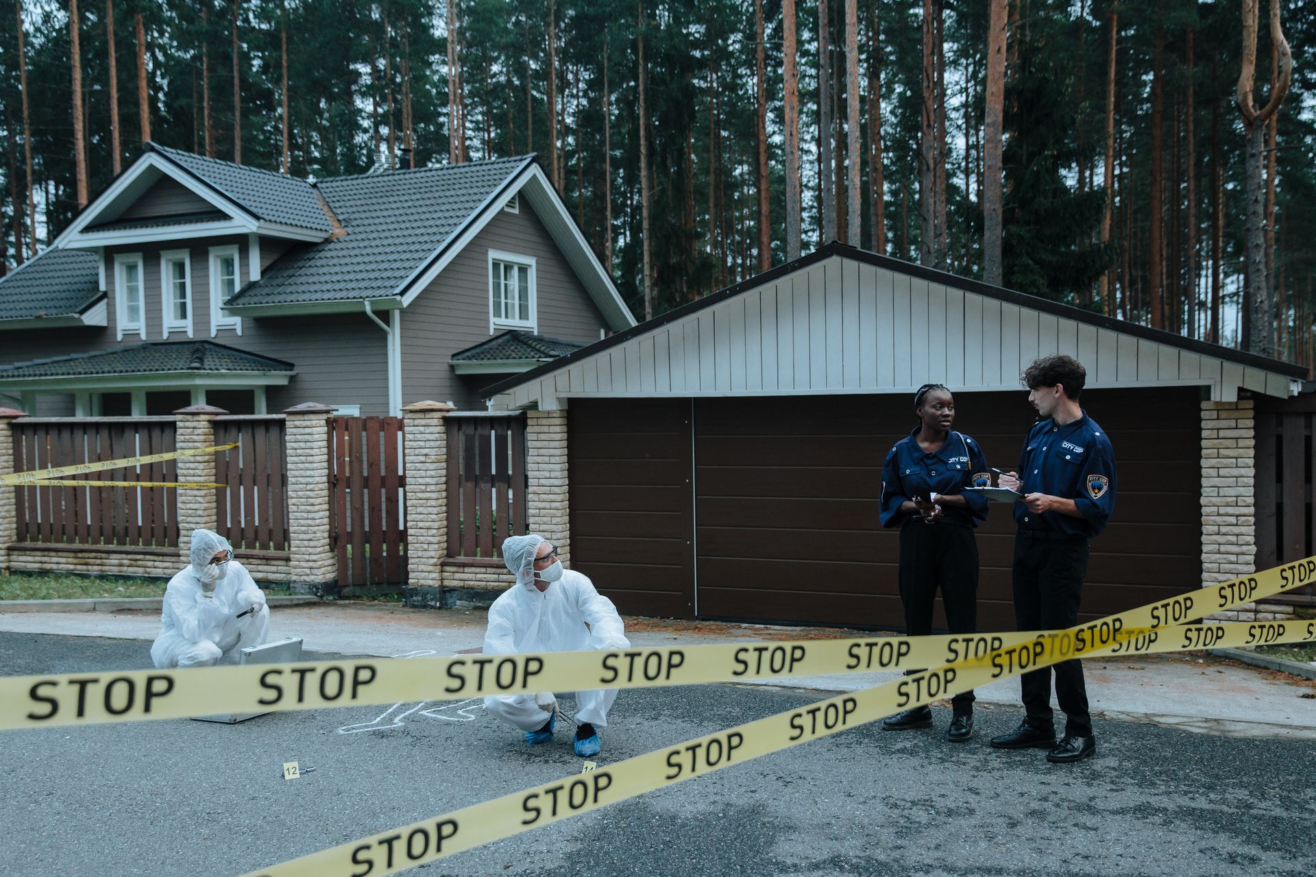 Police Investigation outside and taped off with police offiers and CareFree Restoration Experts working together