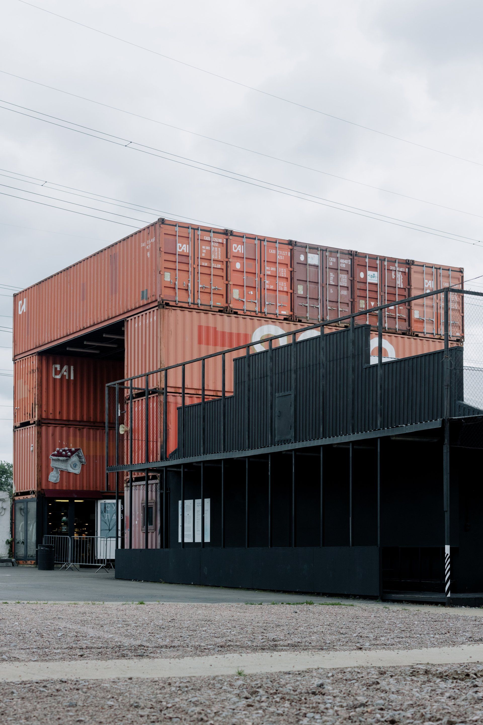 A building with a lot of shipping containers on top of it.