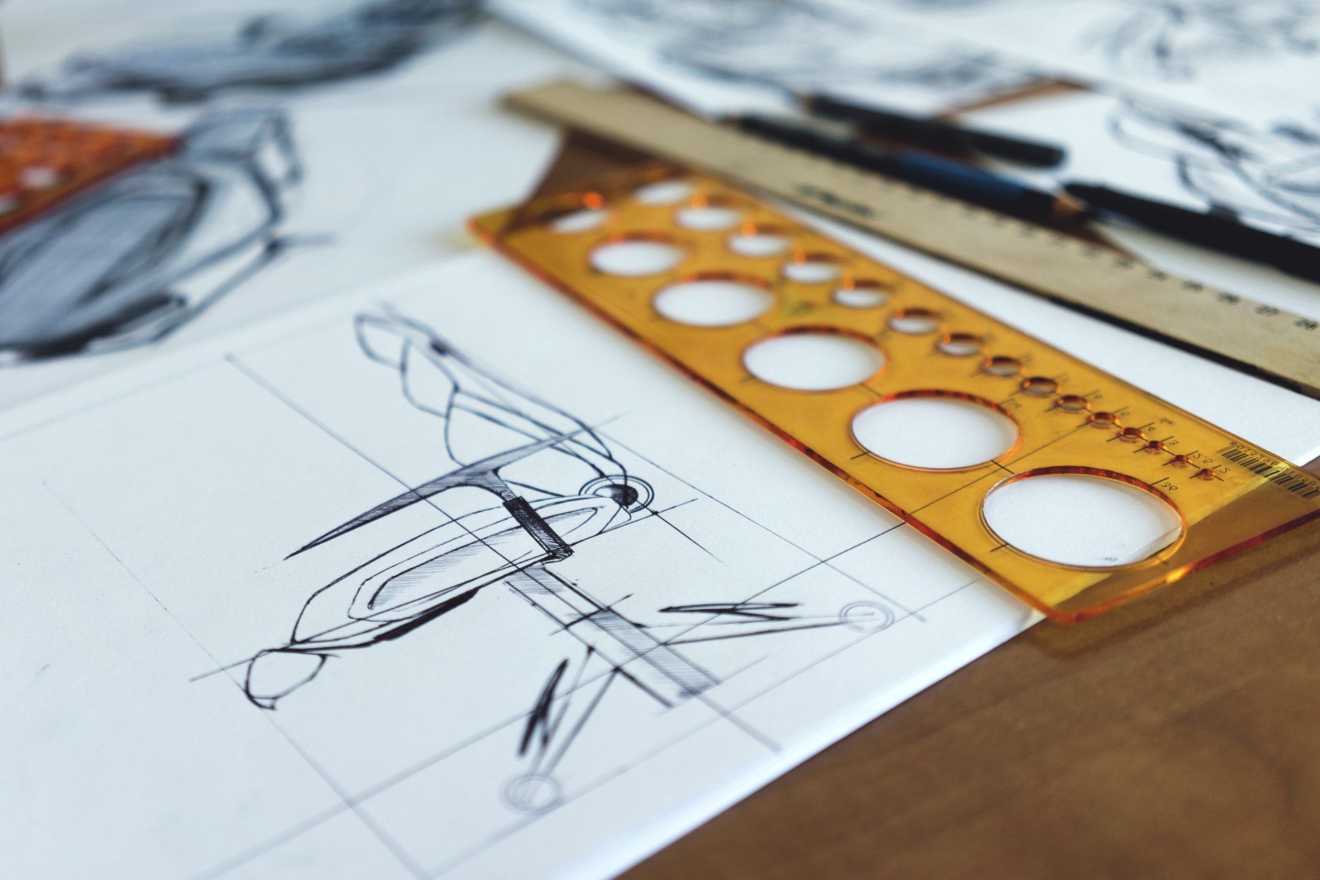 Blueprints and planning documents for a kitchen remodel featuring new cabinets and countertops.