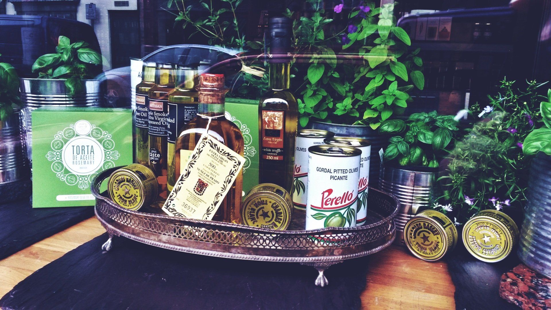 A tray with bottles and cans of fruits and vegetables on it