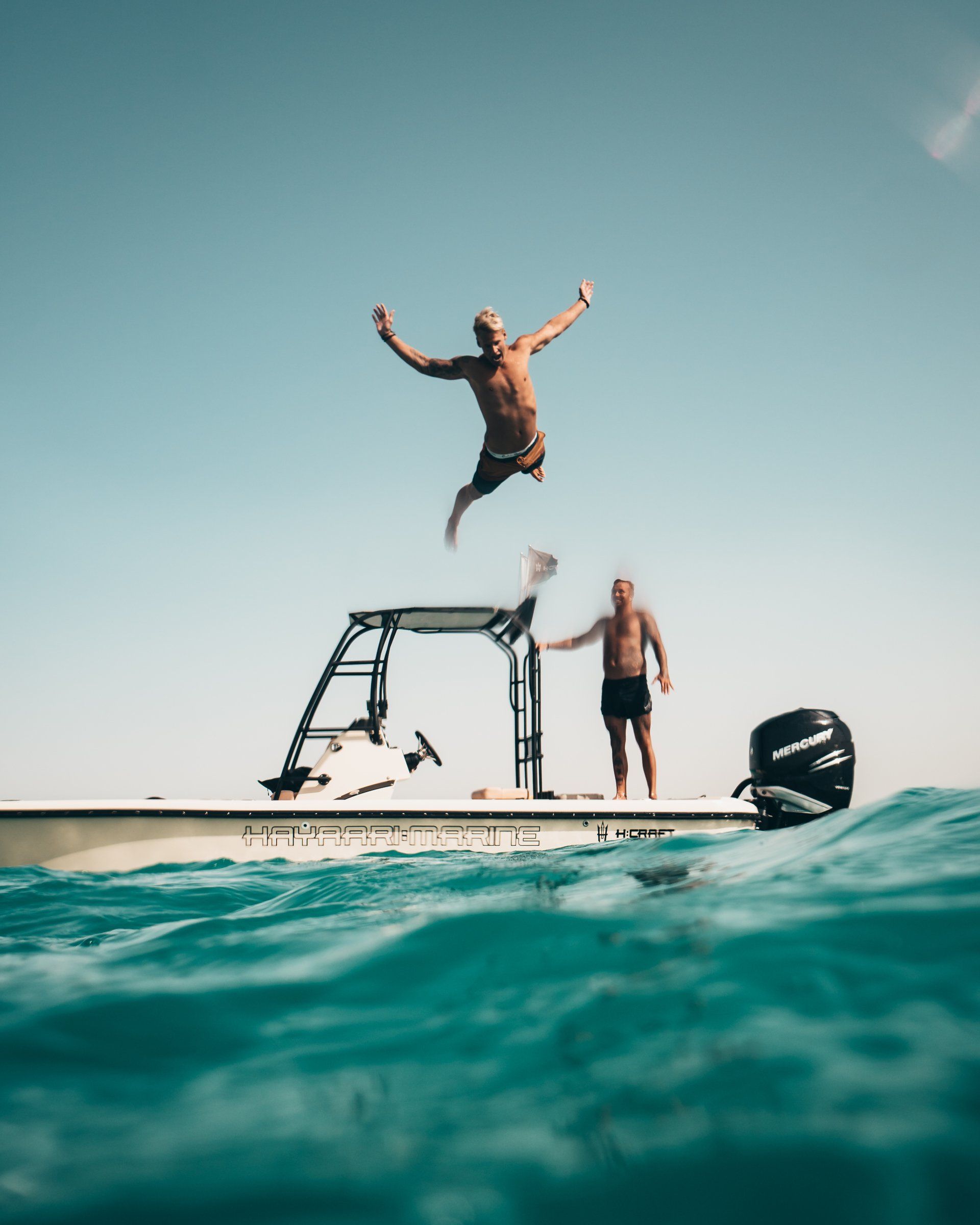 Man jumping into swimming pool