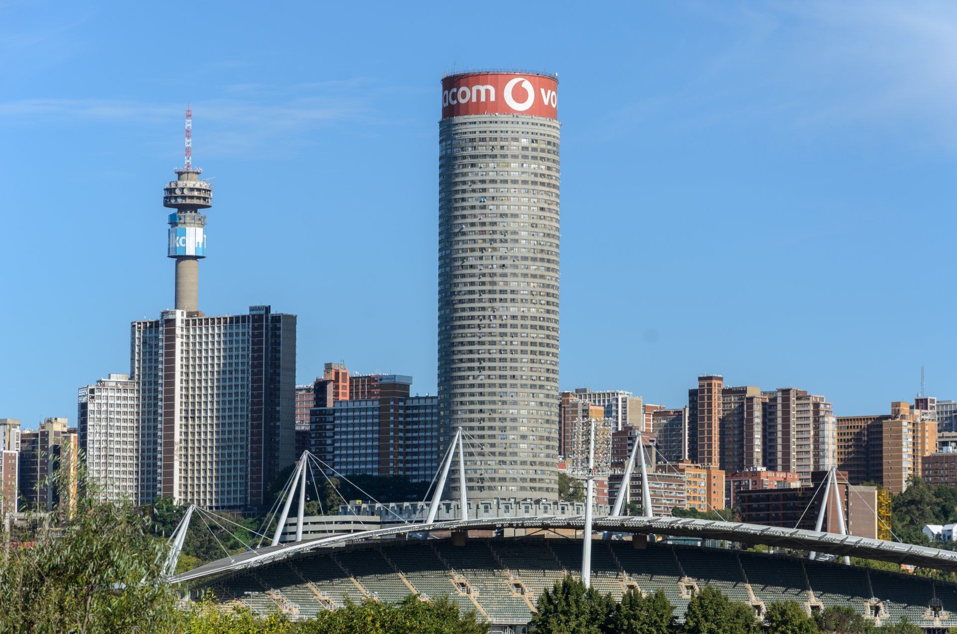 A very tall building with the word vodafone on it
