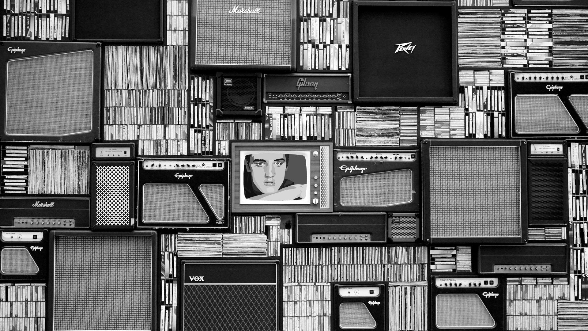 un muro pieno di amplificatori e cd e uno amplificatore epiphone