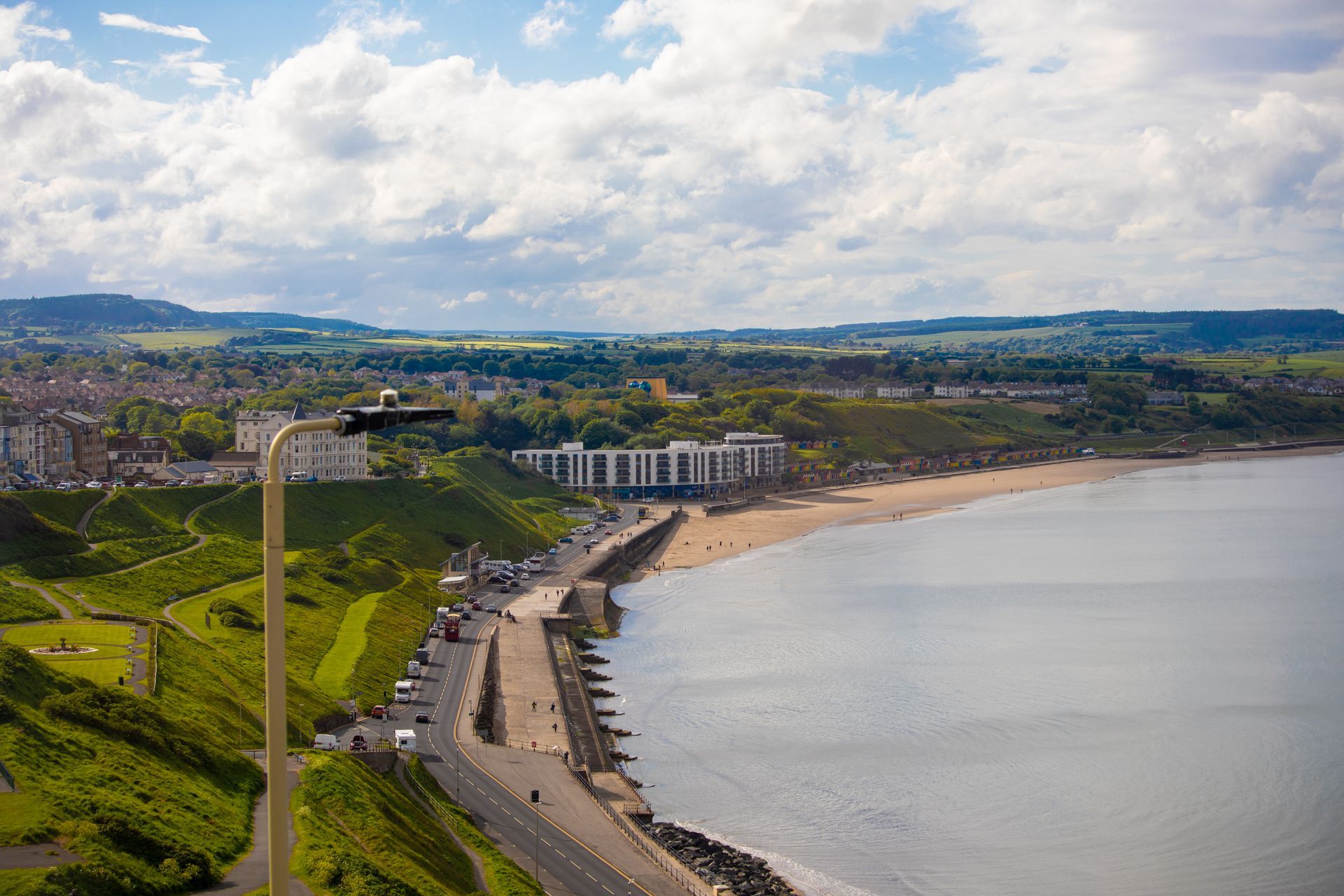 An aerial view of a cliff overlooking a body of water.